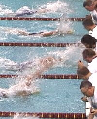 The closest finish possible. Ervin of Cal wins the 50 Free in 21.21 for a new World Record. He finished only .01 ahead of Roland Schoeman the former world record holder.