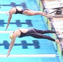 Brooke Bennett of Blue Wave, and Julie Varozza of Santa Clara, dive in for the 800 Free.