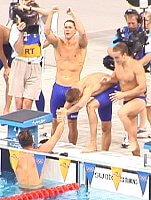 The American foursome of Lenny Krayzelburg, Ed Moses, Ian Crocker, and Gary Hall Jr. celebrate setting a new world record on their way to the gold medal in the 400 Medley Relay.