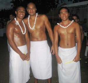 Opening Ceremony with swimmers Leatulevao, Scanlan and Wei leading the American Samoan team with flag and placard.