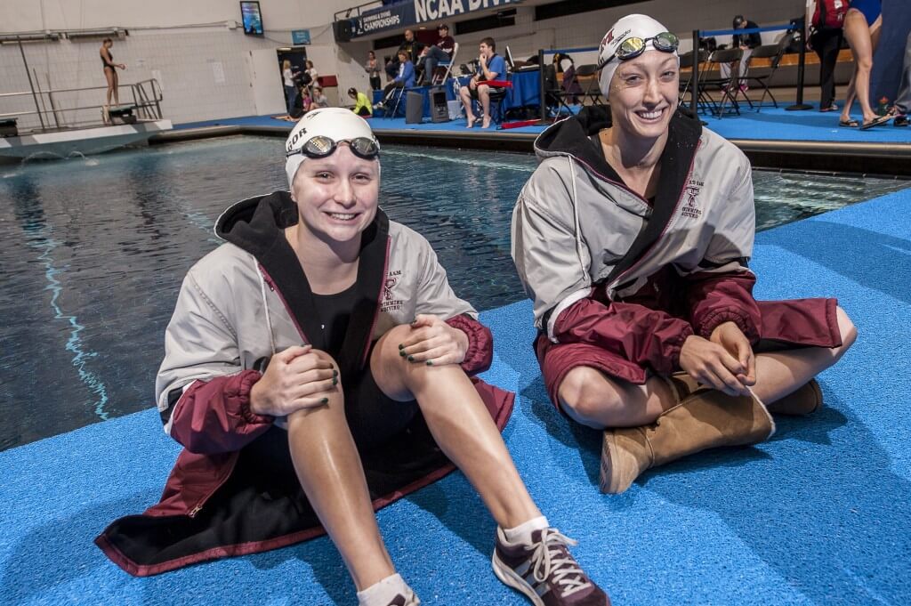 Ashley McGregor and Breeja Larson relax before their 100 breaststroke heats.