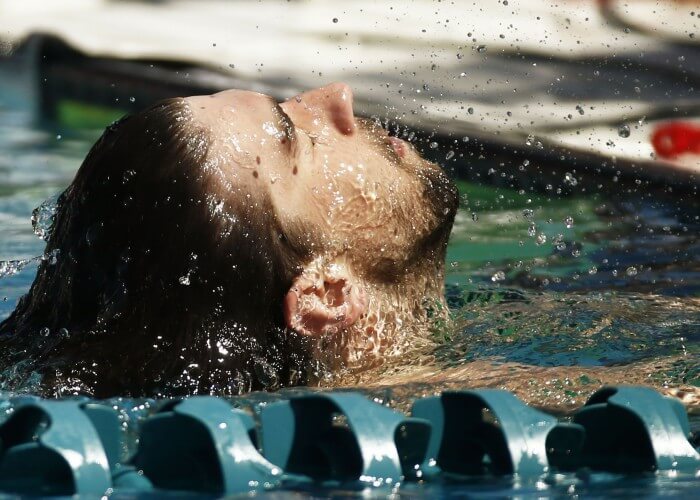 Apr 16, 2015; Mesa, AZ, USA; Michael Phelps reacts after winning his heat in the Men's 100 meter butterfly prelims during the 2015 Arena Pro Swim Series at the Skyline Aquatic Center. Mandatory Credit: Rob Schumacher/Arizona Republic via USA TODAY Sports