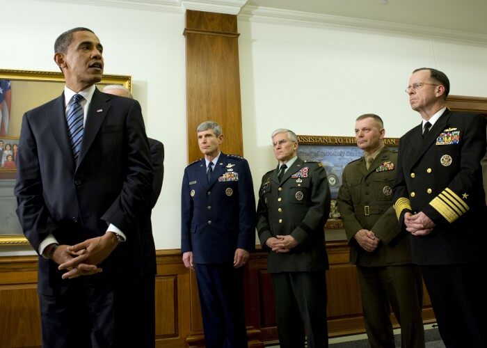 090128-N-0696M-200 WASHINGTON (Jan. 28, 2009) President Barack Obama, with, from left, Gen. Norton Schwartz, Air Force chief of staff; Gen. George W. Casey, U.S. Army chief of staff; Gen. James E. Cartwright, vice chairman of the Joint Chiefs of Staff and Adm. Mike Mullen, chairman of the Joint Chiefs of Staff, addresses the media during his first visit to the Pentagon since becoming commander-in-chief. Obama and Vice President Joe Biden met with Secretary of Defense Robert M. Gates and all the service chiefs for their input on the way ahead in Afghanistan and Iraq. (U.S. Navy photo by Mass Communication Specialist 1st Class Chad J. McNeeley/Released)