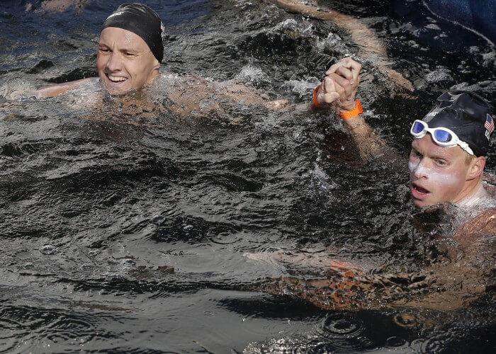 Jul 12, 2015; Toronto, Ontario, CAN; David Heron of the United States (left) celebrates with Chip Peterson of United States after the men's open water swim during the 2015 Pan Am Games at Ontario Place West Channel. Mandatory Credit: Erich Schlegel-USA TODAY Sports