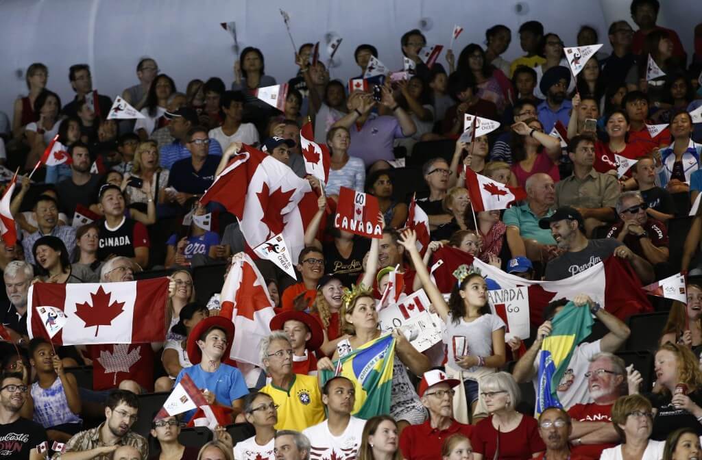 Jul 16, 2015; Toronto, Ontario, CAN; Fans of Canada cheer during the medals ceremony for the men's swimming 4x200m freestyle relay final during the 2015 Pan Am Games at Pan Am Aquatics UTS Centre and Field House. Mandatory Credit: Rob Schumacher-USA TODAY Sports