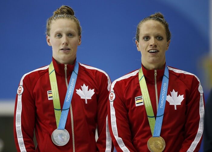 Jul 15, 2015; Toronto, Ontario, CAN; Hilary Caldwell and Dominique Bouchard of Canada on the medal stand for the women’s 200m backstroke final during the 2015 Pan Am Games at Pan Am Aquatics UTS Centre and Field House. Mandatory Credit: Erich Schlegel-USA TODAY Sports