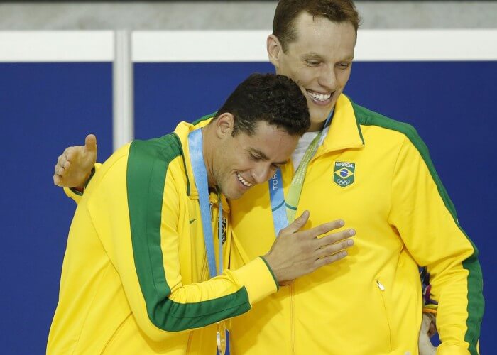 Jul 18, 2015; Toronto, Ontario, CAN; Thiago Pereira of Brazil (left) celebrates with Henrique Rodrigues of Brazil (right) on the podium after the men's swimming 200m individual medley final during the 2015 Pan Am Games at Pan Am Aquatics UTS Centre and Field House. Mandatory Credit: Erich Schlegel-USA TODAY Sports