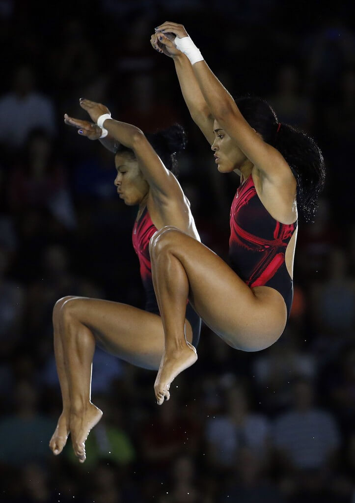 Jul 13, 2015; Toronto, Ontario, USA; Yaima Mena and Annia Rivera of Cuba compete in the women's synchronized 10m platform final during the 2015 Pan Am Games at Pan Am Aquatics UTS Centre and Field House. Mandatory Credit: Rob Schumacher-USA TODAY Sports