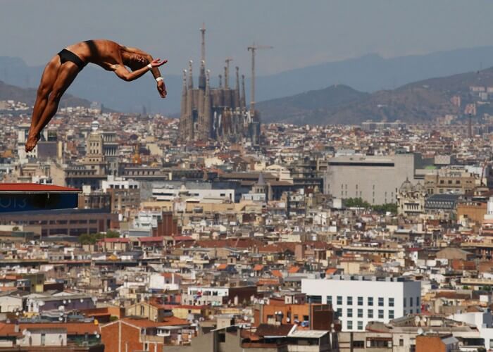 BARCELONA, SPAIN - JULY 28: Jeinkler Aguirre of Cuba competes during the Men's 10m Platform Diving final on day nine of the 15th FINA World Championships at Piscina Municipal de Montjuic on July 28, 2013 in Barcelona, Spain. (Photo by Al Bello/Getty Images)