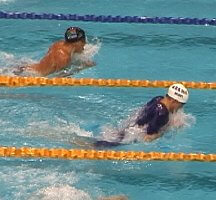 Ed Moses leading in the 100 Breast.