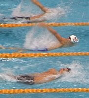 Neil Walker has a slight lead at the 65m mark in the heats of the 100 Back.