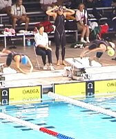 Haley Cope and Amy Van Dyken diving in for the 50 Free.