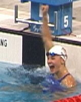 Megan Quann pumps her fist following her gold medal performance in the 100 Breast.