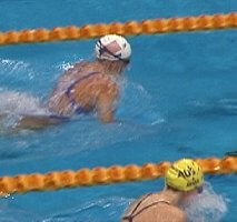 Megan Quann of the USA, swimming to victory in the 100 Breast, just ahead of silver medalist Leisel Jones of Australia .