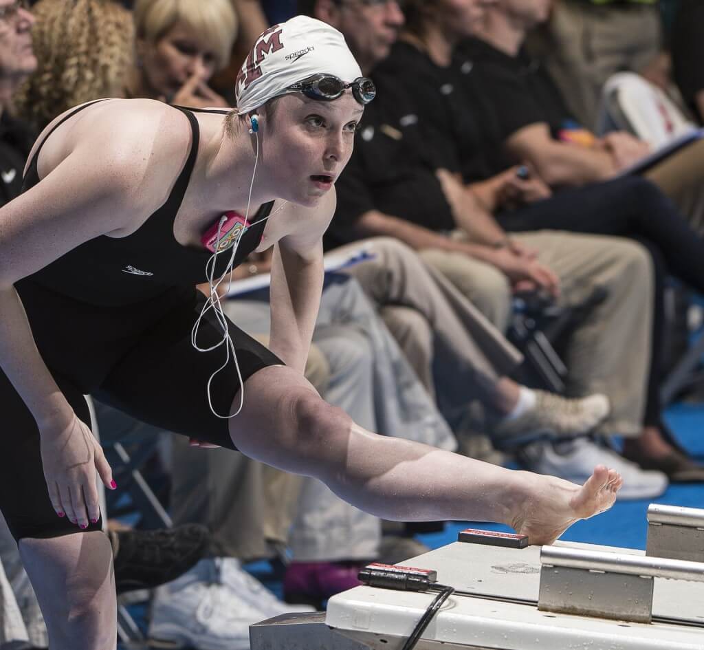 Cammille Adams stretches before the 500 free.