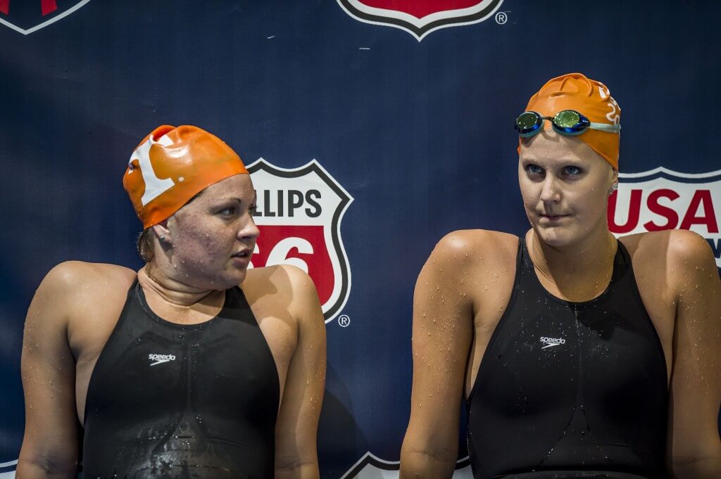 Mary Griffith and Lindsay Gendron rest behind the blocks following their 200 freestyle prelim heat.