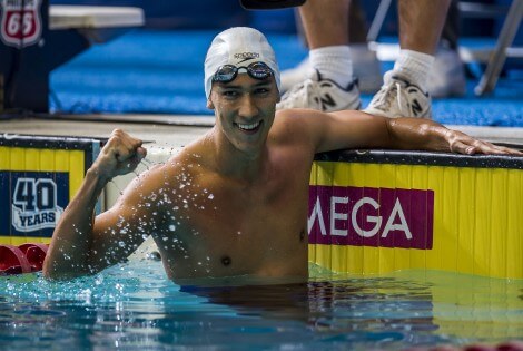 Eugene Godsoe wins the 100 butterfly.