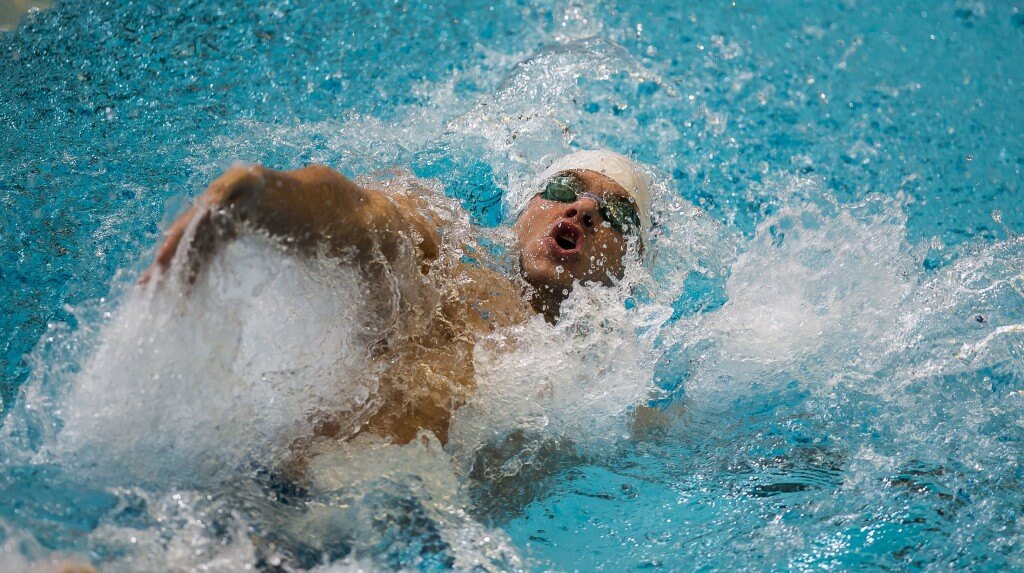 David Plummer places third in the prelims of the 100 backstroke.