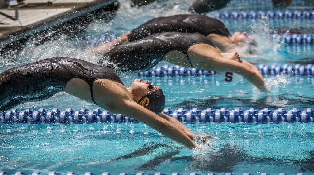 Cindy Tran and Felicia Lee start their heat of the 100 backstroke.
