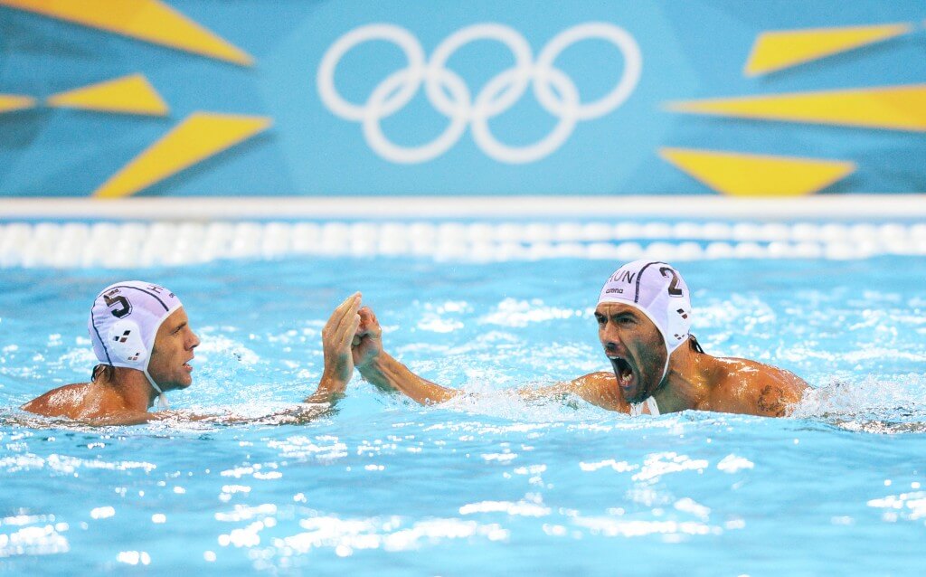 Aug 6, 2012; London, United Kingdom; Hungary centre back Tama Varga (2) celebrates his goal with defenseman Tamas Kasas (5) in a preliminary match against the USA during the London 2012 Olympic Games at Water Polo Arena. Mandatory Credit: James Lang-USA TODAY Sports
