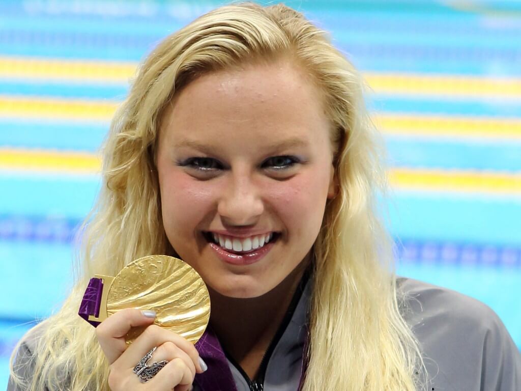 Sep 6, 2012; London, United Kingdom; Jessica Long (USA) collects her gold medal for the women's 100m freestyle S8 final during the London 2012 Paralympic Games at Aquatics Centre. Mandatory Credit: Paul Cunningham-USA TODAY Sports