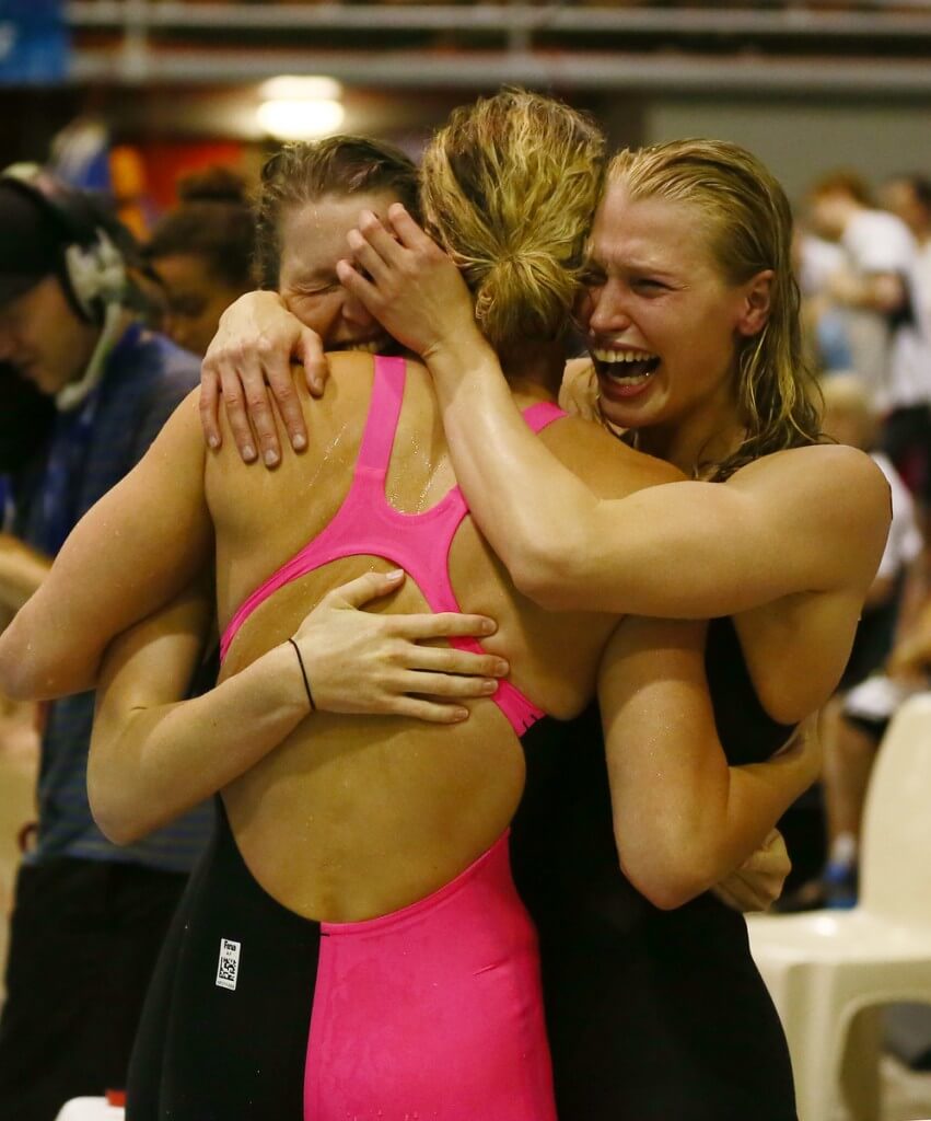 Ellen Quirk and Samantha Lucie-Smith of the NZL Woman's 4 x 100m relay team celebrate with team mate Laura Quilter after qualifying for the Commonwealth Games during Day Four, session eight of the State New Zealand Open Swimming Champs, Westwave Aquatics, Henderson, Auckland, New Zealand. Wednesday 11 April 2014. Photo: Simon Watts/www.bwmedia.co.nz/Swimming New Zealand
