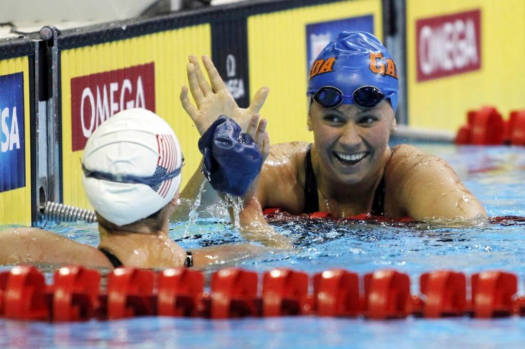 Jun 27, 2012; Omaha, NE, USA; Elizabeth Beisel (right) and Ariana Kukors high-five after competing in the preliminaries of the womens 200m individual medley in the 2012 U.S. Olympic swimming team trials at the CenturyLink Center. Mandatory Credit: Matt Ryerson-USA TODAY Sports