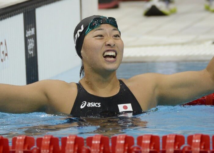 Jul 30, 2012; London, United Kingdom; Satomi Suzuki (JPN) reacts after finishing in third in the women's 100m breaststroke finals during the London 2012 Olympic Games at Aquatics Centre. Mandatory Credit: Richard Mackson-USA TODAY Sports