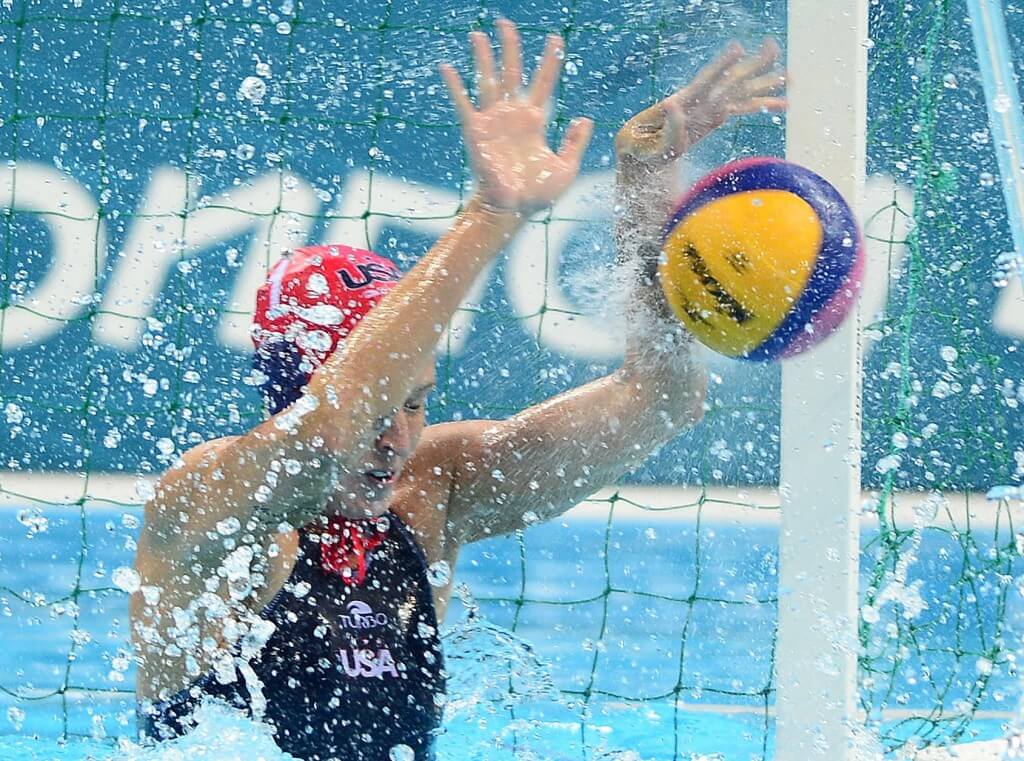 Jul 30, 2012; London, United Kingdom; United States goal keeper Betsey Armstrong (1) blocks a shot against Hungary in the first quarter in the women's preliminary round during the 2012 London Olympic Games at Water Polo Arena. Mandatory Credit: Andrew Weber-USA TODAY Sports