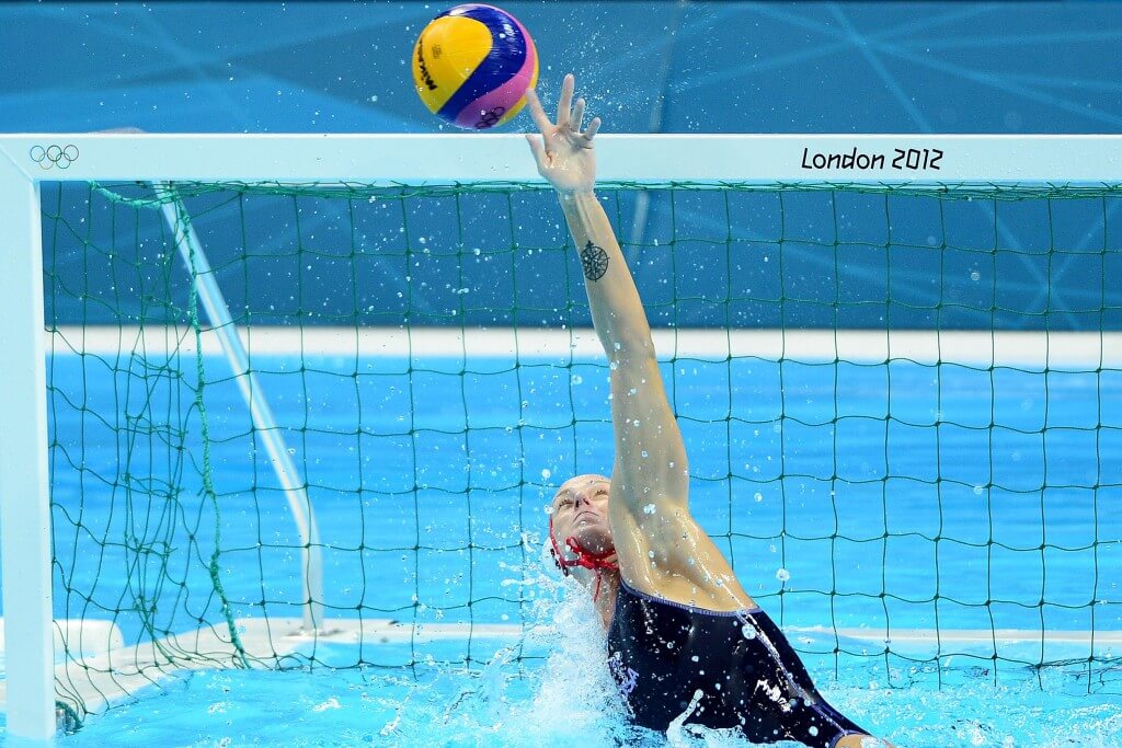 Aug 7, 2012; London, United Kingdom; USA goal keeper Betsey Armstrong (1) tips the ball over the net in overtime against Australia in the women's semifinal in the London 2012 Olympic Games at Water Polo Arena. Mandatory Credit: Andrew Weber-USA TODAY Sports