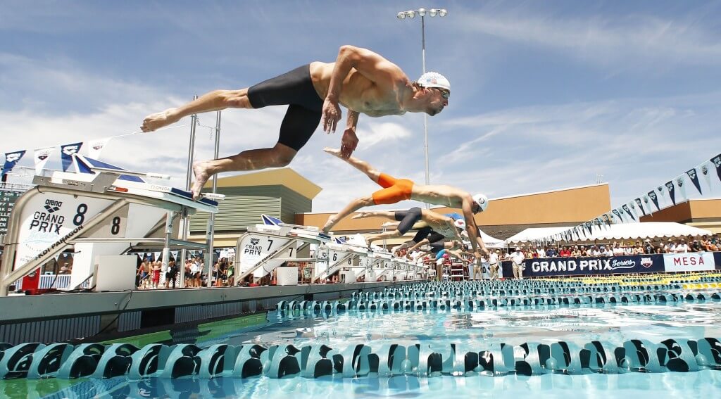 Apr 25, 2014; Mesa, AZ, USA; Michael Phelps dives into the pool for the 50m freestyle prelims during the Arena Grand Prix at Skyline Aquatic Center. Mandatory Credit: Rob Schumacher-USA TODAY Sports