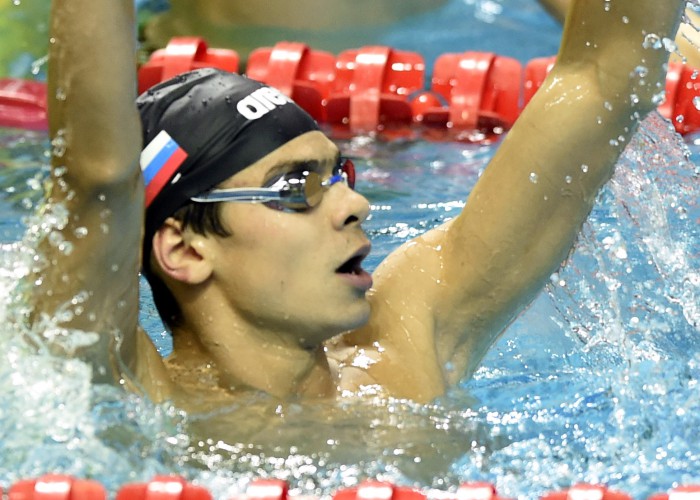 (140820) -- Nanjing, Aug 20,2014 (Xinhua) -- Evgeny Rylov of Russian Federation celebrates after the final of Men's 50m Backstroke of Nanjing 2014 Youth Olympic Games in Nanjing, capital of east China?s Jiangsu Province, on August 20, 2014. Evgeny Rylov won the gold. (Xinhua/Yue Yuewei) (lyq)