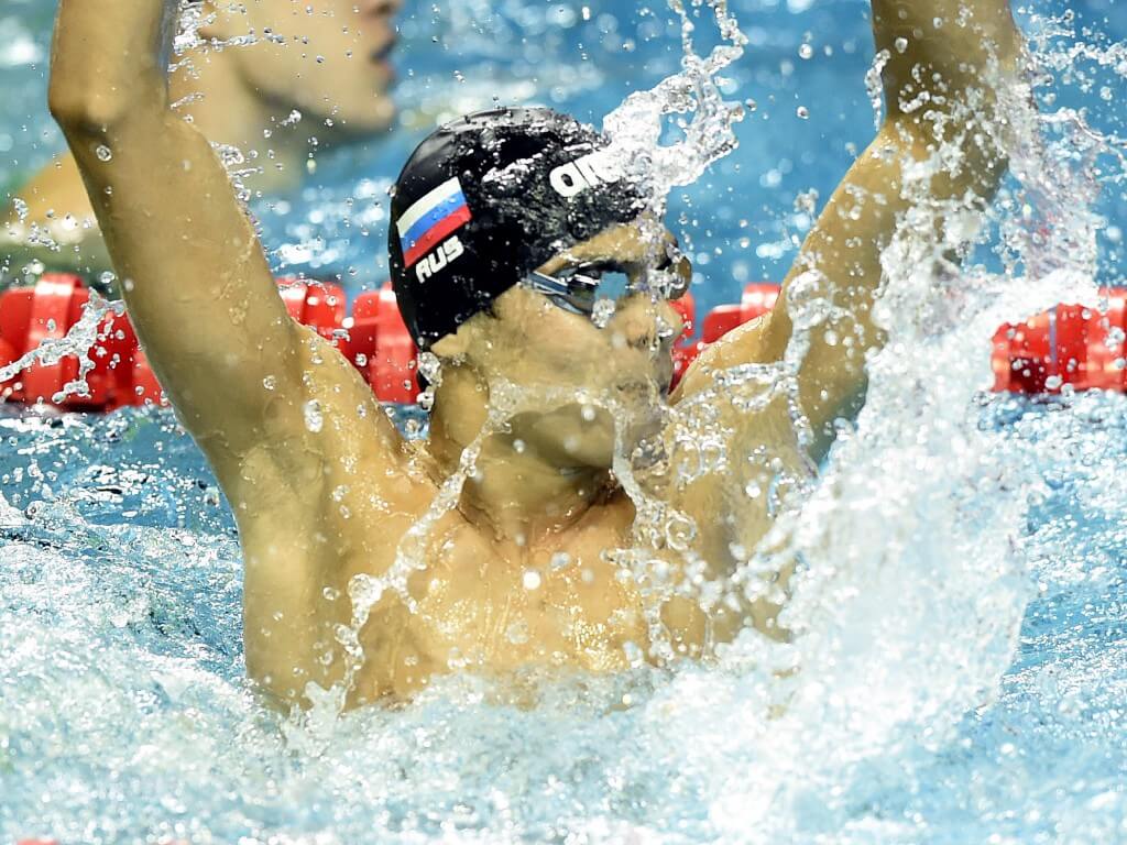(140820) -- Nanjing, Aug 20,2014 (Xinhua) -- Evgeny Rylov of Russian Federation celebrates after the final of Men's 50m Backstroke of Nanjing 2014 Youth Olympic Games in Nanjing, capital of east China?s Jiangsu Province, on August 20, 2014. Evgeny Rylov won the gold. (Xinhua/Yue Yuewei) (lyq)