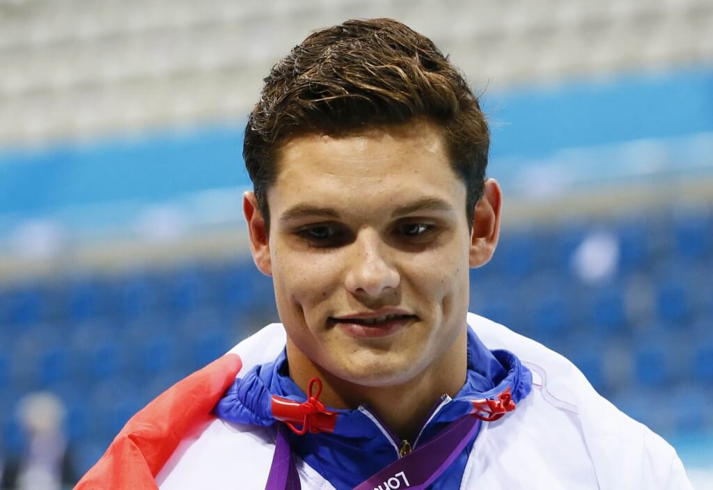 Aug 3, 2012; London, United Kingdom; Florent Manaudou (FRA) celebrates after winning the gold medal in the men's 50m freestyle final during the London 2012 Olympic Games at the Aquatics Centre. Mandatory Credit: Rob Schumacher-USA TODAY Sports