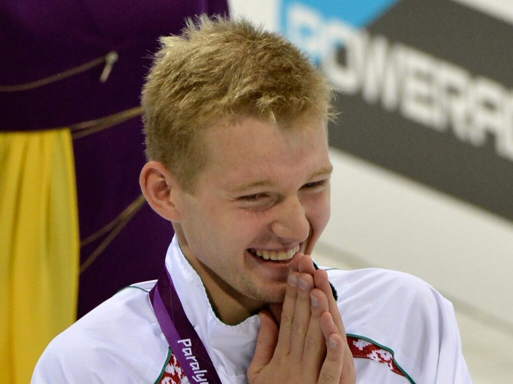 Sep 7, 2012; London, United Kingdom; Ihar Boki (BLR) celebrates after receiving his gold medal during the victory ceremony for the men's 200m IM SM13 during the London 2012 Paralympic Games at Aquatics Centre. Mandatory Credit: Leo Mason-USA TODAY Sports
