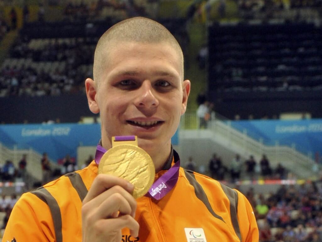 Aug 31, 2012; London, United Kingdom; Marc Evers (NED) poses with his gold medal after receiving it in the men's 100m backstroke - S14 during the London 2012 Paralympic Games at Aquatics Centre. Mandatory Credit: Andrew Fielding-USA TODAY Sports