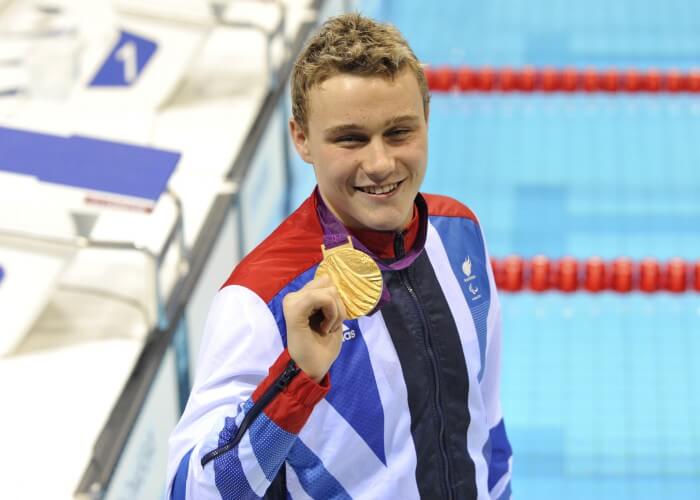 Sep 5, 2012; London, United Kingdom; Oliver Hynd (GBR) displays his gold medal after the medal ceremony for the men's 200m IM - SM8 during the London 2012 Paralympic Games at Aquatics Centre. Mandatory Credit: Andrew Fielding-USA TODAY Sports