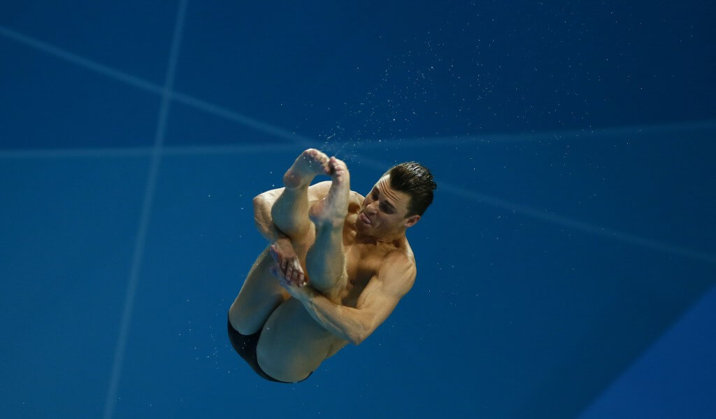 Aug 7, 2012; London, United Kingdom; Troy Dumais (USA) performs his dive at the men's 3m springboard semifinal during the London 2012 Olympic Games at Aquatics Centre. Mandatory Credit: Rob Schumacher-USA TODAY Sports