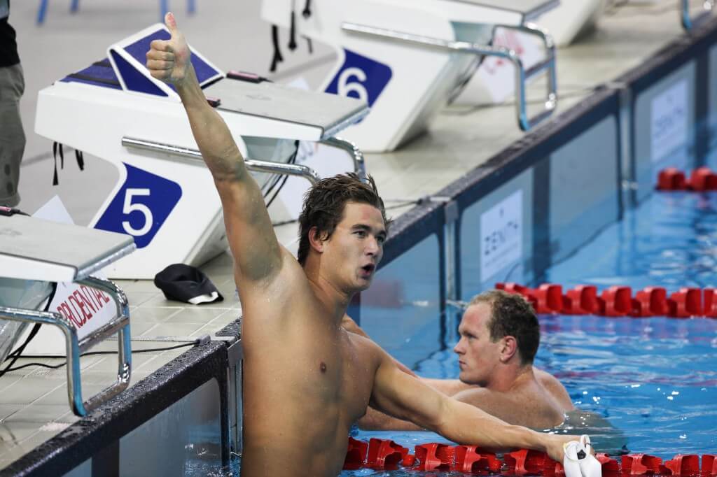 Swimming - Prudential Singapore Swim Stars 2014 - OCBC Aquatic Centre, Singapore Sports Hub, Singapore - 5/9/14 Men's 50m Freestyle Final - Nathan Adrian of USA (L) celebrates his win Mandatory Credit: Action Images / Norman Ng Livepic EDITORIAL USE ONLY.