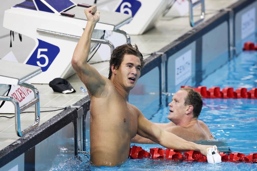 Swimming - Prudential Singapore Swim Stars 2014 - OCBC Aquatic Centre, Singapore Sports Hub, Singapore - 5/9/14 Men's 50m Freestyle Final - Nathan Adrian of USA (L) celebrates his win Mandatory Credit: Action Images / Norman Ng Livepic EDITORIAL USE ONLY.