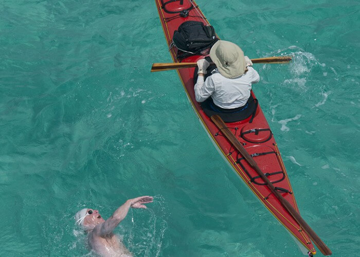A competitor in the Swim for Alligator Lighthouse race swims next to his support kayak Saturday, Sept. 20, 2014, off Islamorada, Fla., in the Florida Keys. The eight-mile roundtrip open water swim served as a fundraiser for local student college scholarships and to create awareness for the need to preserve six aging lighthouses off the Keys island chain. FOR EDITORIAL USE ONLY (Andy Newman/Florida Keys News Bureau/HO)