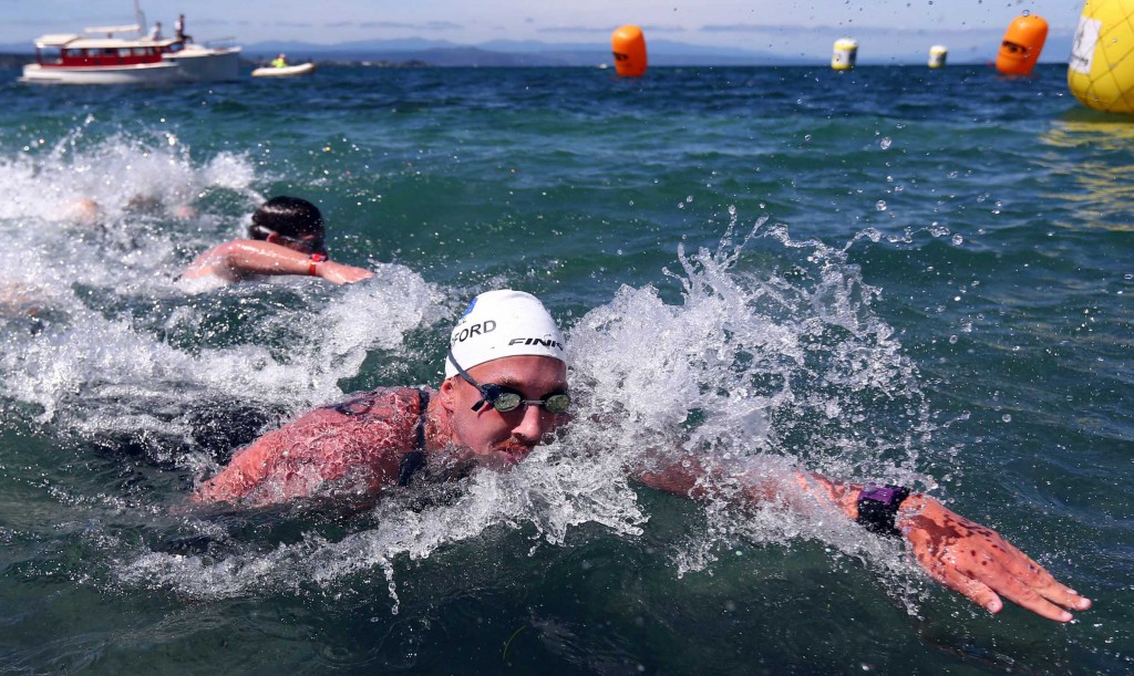 Kane Radford wins from Phillip Ryan during 5km race of the Swimming New Zealand Open Water Championships, Lake Taupo, Taupo. Sunday 11 January 2015. Photo: Simon Watts/www.bwmedia.co.nz