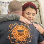 Madison Scaff hugs her father, Lt. Shannon Scaff, after he finished his goal of swimming 24 hours in a pool to memorialize the fallen aircrew of Coast Guard helicopter 6535 in Charleston, S.C., Feb. 28, 2015. Scaff trained for over a year to help prepare him for this test of endurance and will. U.S. Coast Guard photo by Petty Officer 1st Class Stephen Lehmann.