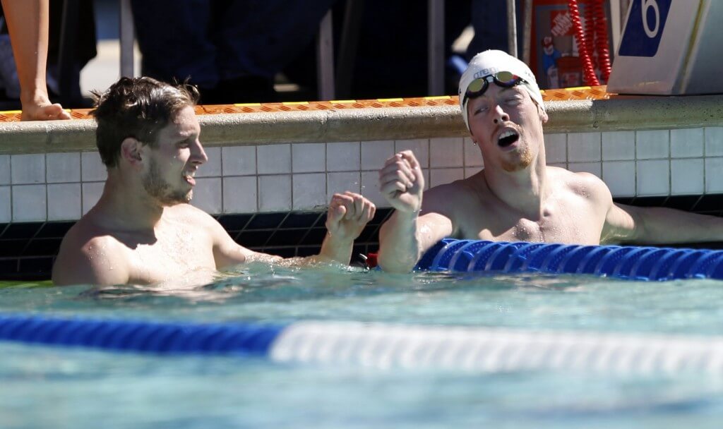 Jun 18, 2015; Santa Clara, CA, USA; Michael McBroom (USA) on left, is congratulated on his first place finish by second place finisher Connor Jaeger (USA) after they completed the men's 800M freestyle championship final during day one of the Arena Pro Series at Santa Clara at the George F. Haines International Swim Center. Mandatory Credit: Bob Stanton-USA TODAY Sports