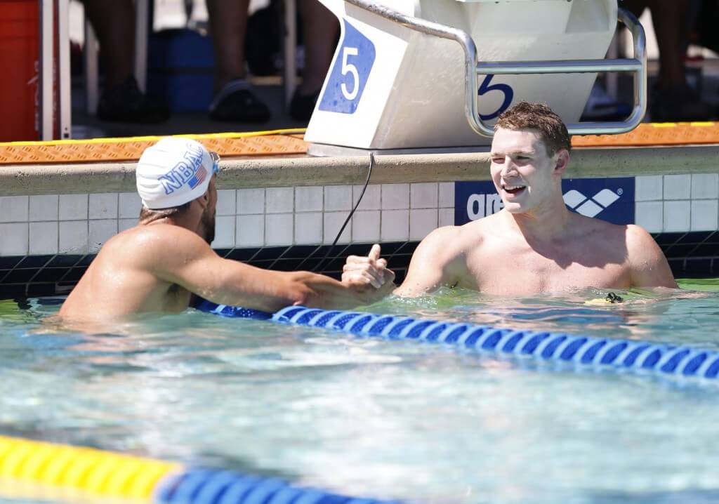 Jun 21, 2015; Santa Clara, CA, USA; Ryan Murphy (USA), right, is congratulated by Michael Phelps (USA) after Murphy won the final qualifying heat of the Men's 200IM during the morning session of day four at the George F. Haines International Swim Center in Santa Clara, Calif. Mandatory Credit: Bob Stanton-USA TODAY Sports