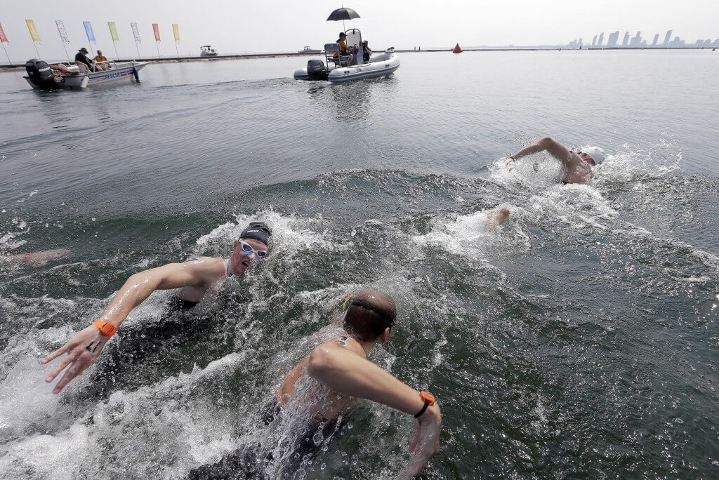 Jul 12, 2015; Toronto, Ontario, CAN; Chip Peterson of the United States and Richard Wienberger of Canada compete in the men's open water swim during the 2015 Pan Am Games at Ontario Place West Channel. Mandatory Credit: Erich Schlegel-USA TODAY Sports