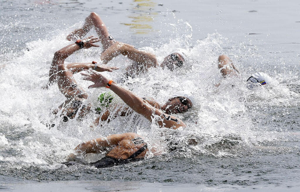 Jul 12, 2015; Toronto, Ontario, CAN; Competitors race at the start of the men's open water swim during the 2015 Pan Am Games at Ontario Place West Channel. Mandatory Credit: Erich Schlegel-USA TODAY Sports