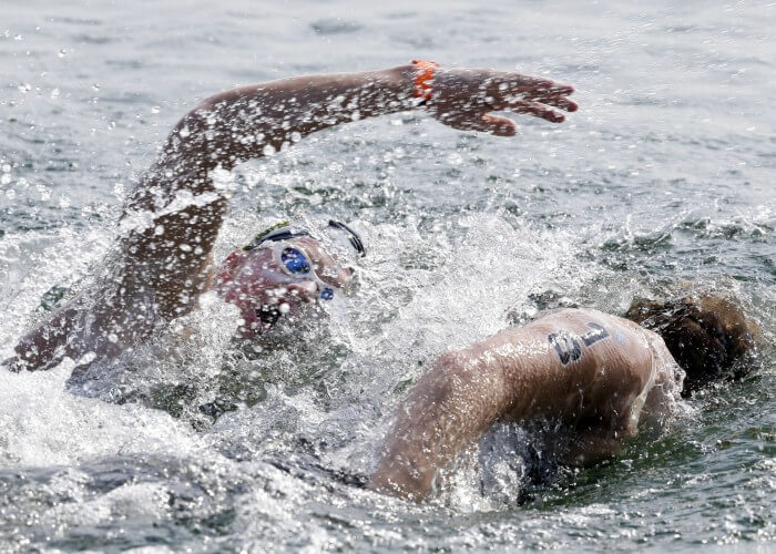 Jul 12, 2015; Toronto, Ontario, CAN; Chip Peterson of the United States (top) races Richard Weinberger of Canada in the men's open water swim during the 2015 Pan Am Games at Ontario Place West Channel. Mandatory Credit: Erich Schlegel-USA TODAY Sports