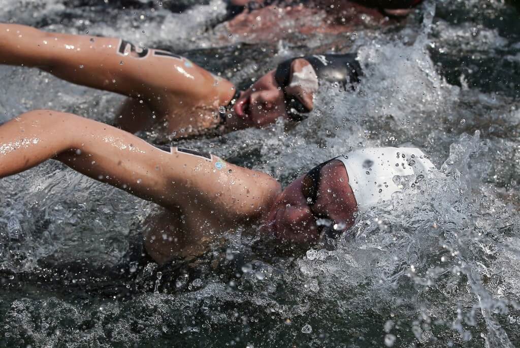 Jul 11, 2015; Toronto, Ontario, CAN; Monserrat Ortuno of Mexico (bottom) races against Julia Arino of Argentina (top) in the womenÕs 10km open water swimming competition during the 2015 Pan Am Games at Ontario Place West Channel. Mandatory Credit: Tom Szczerbowski-USA TODAY Sports
