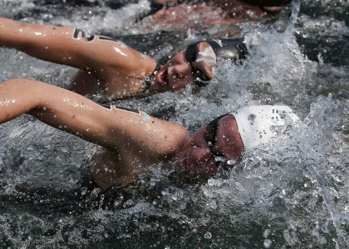 Jul 11, 2015; Toronto, Ontario, CAN; Monserrat Ortuno of Mexico (bottom) races against Julia Arino of Argentina (top) in the womenÕs 10km open water swimming competition during the 2015 Pan Am Games at Ontario Place West Channel. Mandatory Credit: Tom Szczerbowski-USA TODAY Sports